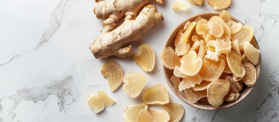 Leinwandbilder - Sweet and Spicy Candied Ginger in a Bowl on a light backdrop Copy space