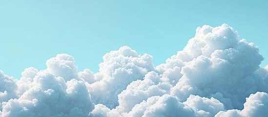 Wall Mural - cloudscape against a blue sky backdrop fluffy cumulus clouds in white and grey with an empty sky pro