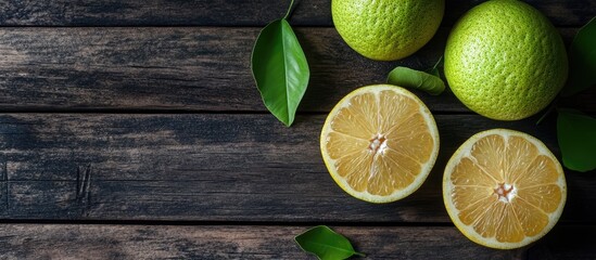 Leinwandbilder - Top view of fresh pomelo on a dark wooden table background for the Mid Autumn Festival fruit. with copy space image. Place for adding text or design