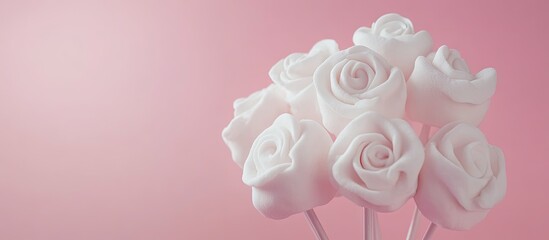 Poster - Bouquet of marshmallow roses set against a pink background Romantic treat Sweet gift Copy space