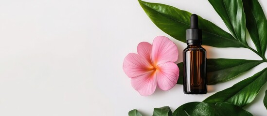 Poster - A bottle of essential oils alongside a tropical flower on a white background Concept of skin and body care. with copy space image. Place for adding text or design