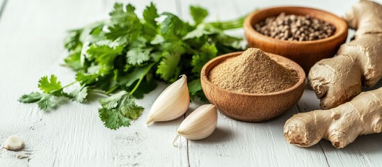 Wall Mural - Variety of spices including ginger garlic and cilantro on a white wooden table. with copy space image. Place for adding text or design