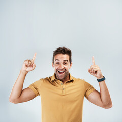 Sticker - Shocked, mockup and man pointing for promotion or deal isolated on a gray studio background. Smile, hand gesture and happy guy in portrait and advertising, marketing offer and approve of copy space