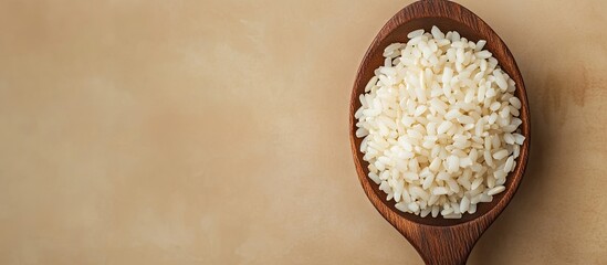 Poster - jasmine rice on a wooden spoon with copyspace