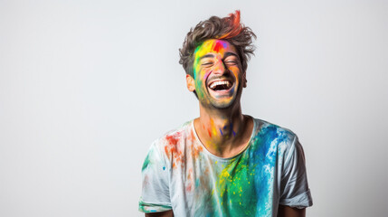 young indian man laughing on white background