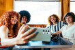 © oneinchpunch - Multiethnic group of friends having meal at 80s vintage diner restaurant - Multiracial young people bonding and having fun, eating in an american fast food burger house