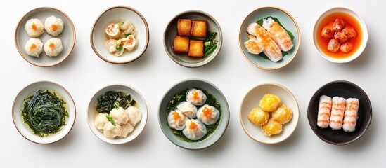 Poster - Bowls filled with traditional Asian cuisine on a white background lemongrass goma wakame prawns and a dish containing dumplings Top view. with copy space image. Place for adding text or design