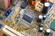 © meepoohyaphoto - Black microchip socket on mainboard background.