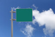 © meepoohyaphoto - Empty green sign with a background of a blue sky and white clouds.