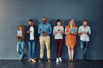 Leinwandbilder - Technology, connectivity and group of business people at wall together with phone, tablet and laptop. Internet, communication and creative team with contact on website, digital network or mobile app