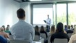 © Anton Gvozdikov - Business presentation in modern office setting with audience paying attention to speaker. Professional atmosphere highlights corporate learning environment.