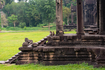 Wall Mural - Monkeys in Angkor Wat, ancient temple ruins in Cambodia