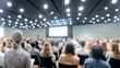 © Anton Gvozdikov - Business professionals listening to presentation in modern conference hall filled with attendees. Focus on learning, networking, collaboration.