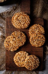 Sunflower seeds, sesame seeds cookies on a dark background