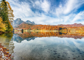 Wall Mural - breathtaking autumn scene of sunny morning on almsee lake.