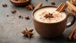 © Dumrongkait - A cup of coffee with cinnamon and star anise on top
