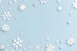 © Iriyalo - White snowflakes on a light blue background