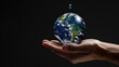 © Vibu design  gallery - Earth drop held in hands at climate conference for water.