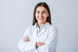 © Kowit - A woman in a white lab coat is smiling and posing for a picture