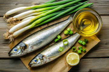 Fresh herring fish with green onions and oil on a wooden table