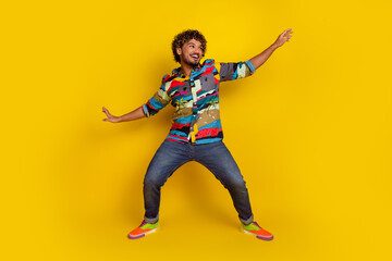 Poster - Full size photo of pretty young guy dance surfing wear trendy colorful outfit isolated on yellow color background