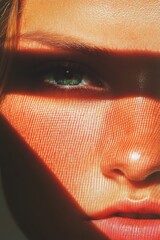 Canvas Print - This is a close-up of a person's face with a red band across their forehead. They have green eyes and red lips.