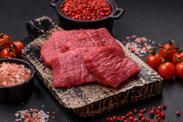 Wall Mural - Juicy fresh raw beef meat with salt, spices and herbs