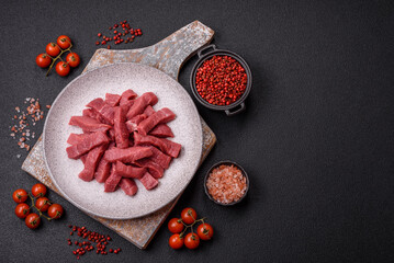 Wall Mural - Juicy fresh raw beef meat with salt, spices and herbs