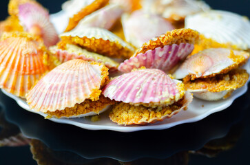 Wall Mural - A plate of food with shells on it