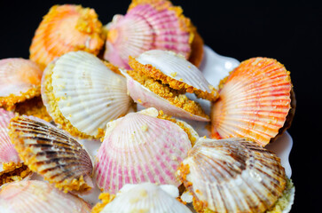 Wall Mural - A plate of food with shells on it