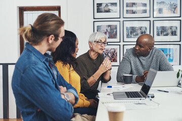 Office, planning and business people with laptop in discussion for company, project and solution. Manager, employees and conversation in meeting for sales report, evaluation and performance review