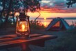 © CojanAI - Camping acetylene lantern on wooden table at sunset
