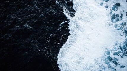 Stunning ocean photograph, half white and half black, captured from above with hyper-realistic detail and simplicity.