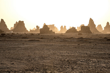 moon landscape of limestone chimneys geological rock formations in a sunset rays at the bottom of dr