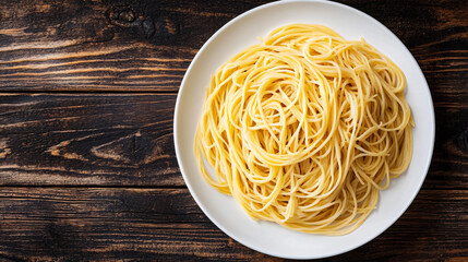 Wall Mural - Heaping pile of delicious spaghetti is served on a white plate, resting on a rustic wooden table