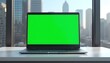© Ali Hamza Tullah - Laptop Green Screen Mockup, placed on a table. Skyscraper background, Laptop Mockup, Green Screen Laptop