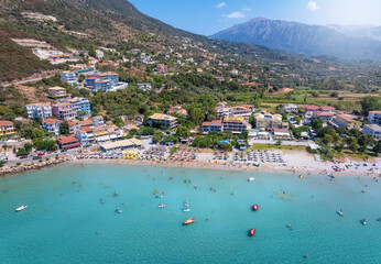 Wall Mural - aerial view of the beautiful beach at vassiliki, ponti, with emerald sea and numerous windsurfers an