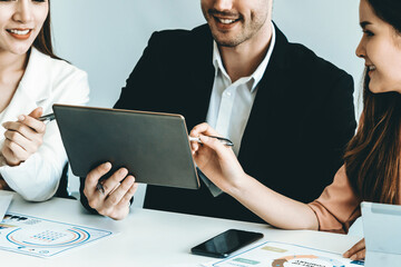 Wall Mural - Businessman is in meeting discussion with colleague businesswomen in modern workplace office. People corporate business team concept. uds