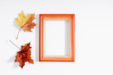 Wall Mural - autumn creative composition. photo frame, dry leaves on white background. fall concept. autumn backg