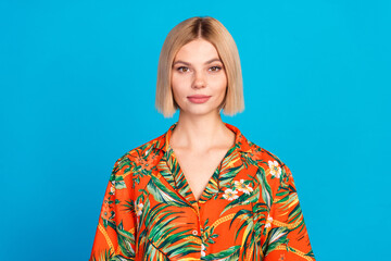 Canvas Print - Photo of charming lovely girl wear stylish orange print clothes isolated on blue color background