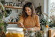 © Ирина Щукина - A woman is smiling and preparing food in a kitchen