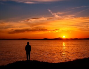 Wall Mural - A lone figure silhouetted against a vibrant sunset, contemplating the horizon.