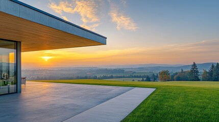 Wall Mural - A modern house overlooks a serene landscape at sunset, showcasing nature's beauty and architectural design.