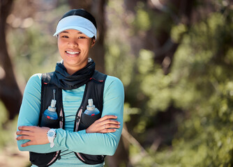 Canvas Print - Happy woman, portrait and arms crossed for hiking in outdoor, travel and ready for trekking exercise. Female person, training and nature for wellness, forest and sports challenge for workout fitness