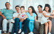 © Haas/peopleimages.com - Happy, couch and portrait of big family to relax in lounge, house or home with smile, pride or care together. Grandparents, mom and dad with children siblings on sofa for bonding, support and love