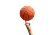 © muse studio - A hand skillfully balances a spinning basketball on one finger, showcasing control and precision.