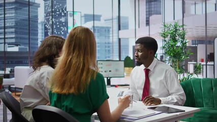 Wall Mural - Businessman attending job interview with the HR employees in office, discussing about career plans and the opportunity of human resources development. Recruitment process in enterprise. Camera B.