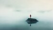 © Abul - A solitary figure stands on a small island in a misty lake, looking out at the vast expanse of fog.