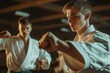 © LimeSky - Teenager trains in karate with instructor in gym