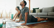 © PeakPoints/peopleimages.com - Fitness, couple and stretching in home for yoga, wellness and spiritual healing. Man, woman and cobra pose in pilates for healthy body, activity in relationship and positive mental health on floor